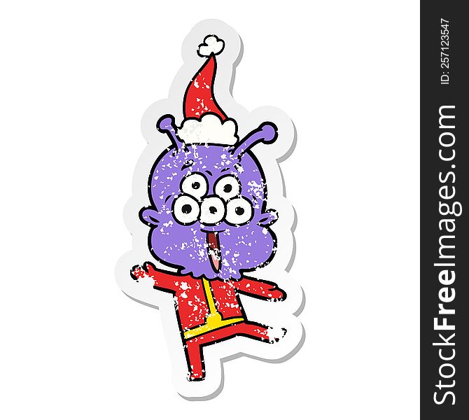 happy hand drawn distressed sticker cartoon of a alien dancing wearing santa hat