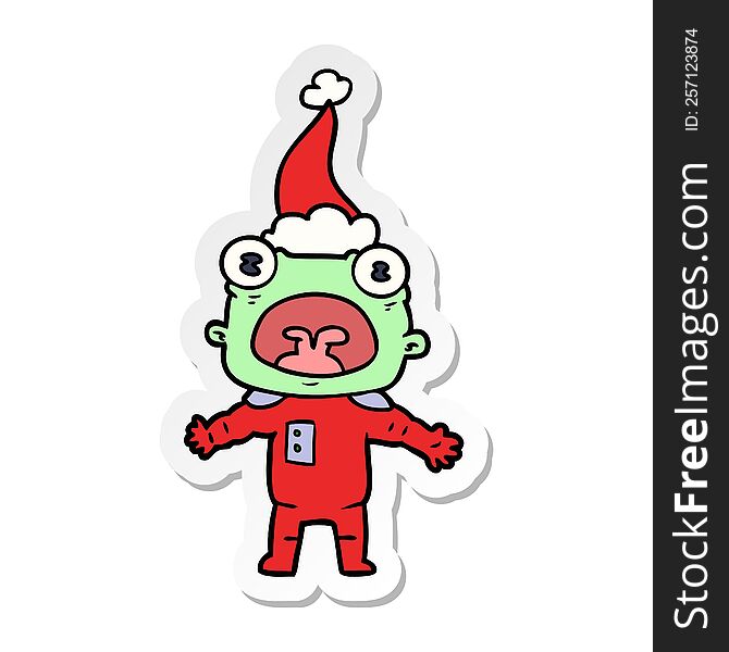 Sticker Cartoon Of A Weird Alien Communicating Wearing Santa Hat