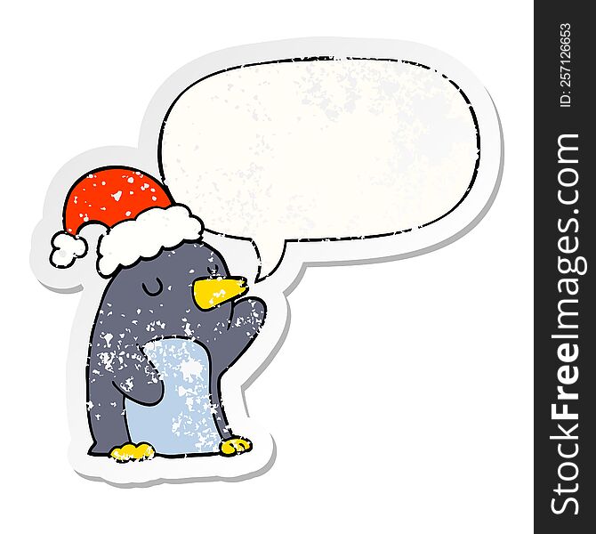 cute cartoon christmas penguin with speech bubble distressed distressed old sticker. cute cartoon christmas penguin with speech bubble distressed distressed old sticker