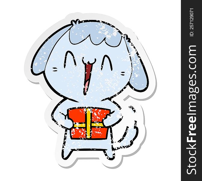 distressed sticker of a cute cartoon dog with christmas present