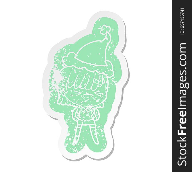 annoyed quirky cartoon distressed sticker of a girl wearing santa hat