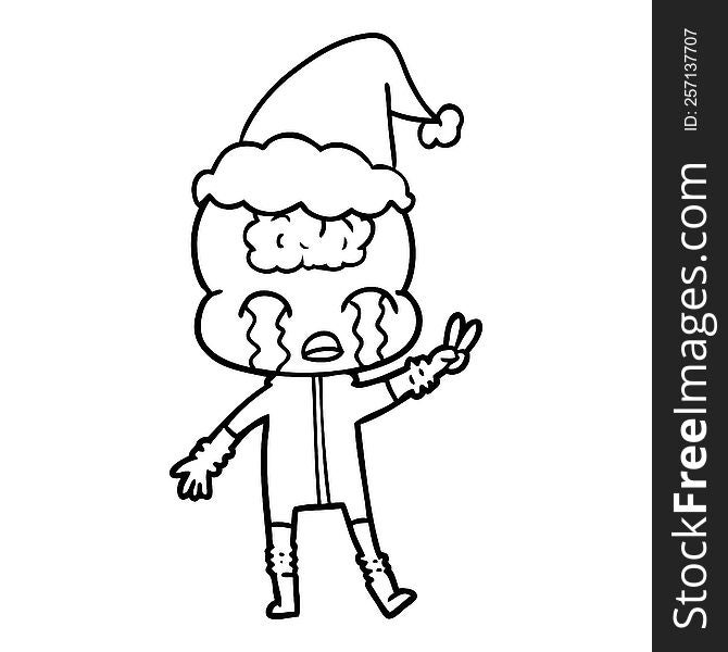 hand drawn line drawing of a big brain alien crying and giving peace sign wearing santa hat
