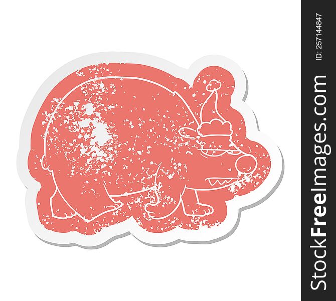 Cartoon Distressed Sticker Of A Angry Polar Bear Wearing Santa Hat