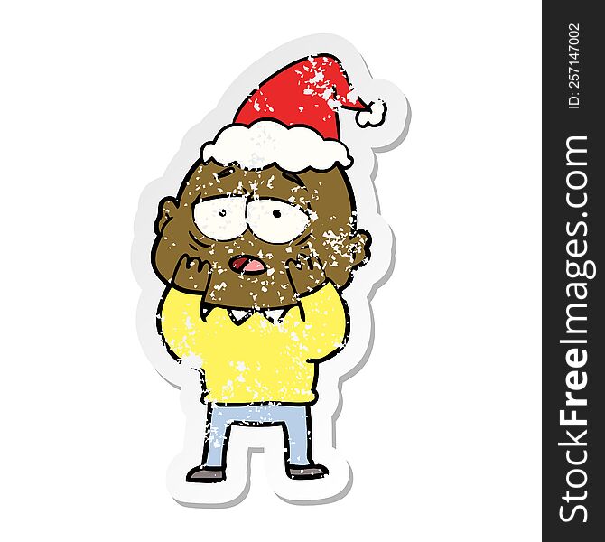 hand drawn distressed sticker cartoon of a tired bald man wearing santa hat