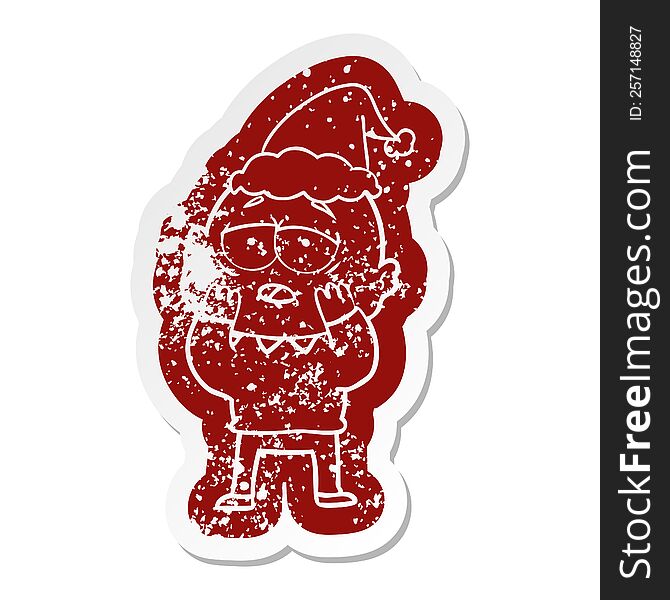 Cartoon Distressed Sticker Of A Tired Bald Man Wearing Santa Hat