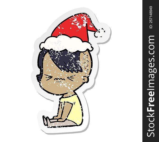 hand drawn distressed sticker cartoon of a annoyed hipster girl wearing santa hat