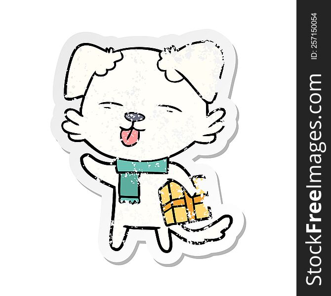 distressed sticker of a cartoon dog with xmas gift