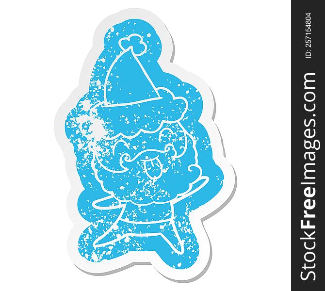 Distressed Sticker Of A Man With Beard Sticking Out Tongue Wearing Santa Hat