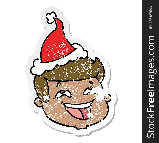 Happy Distressed Sticker Cartoon Of A Male Face Wearing Santa Hat