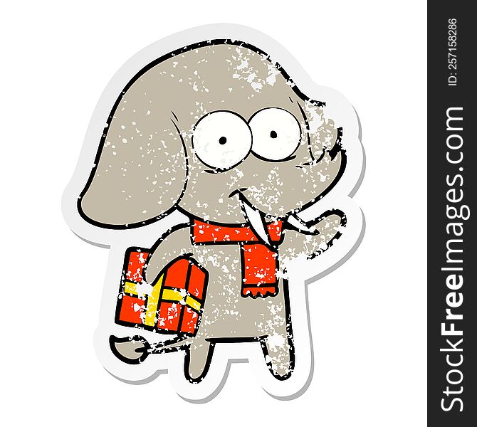 Distressed Sticker Of A Happy Cartoon Elephant With Present
