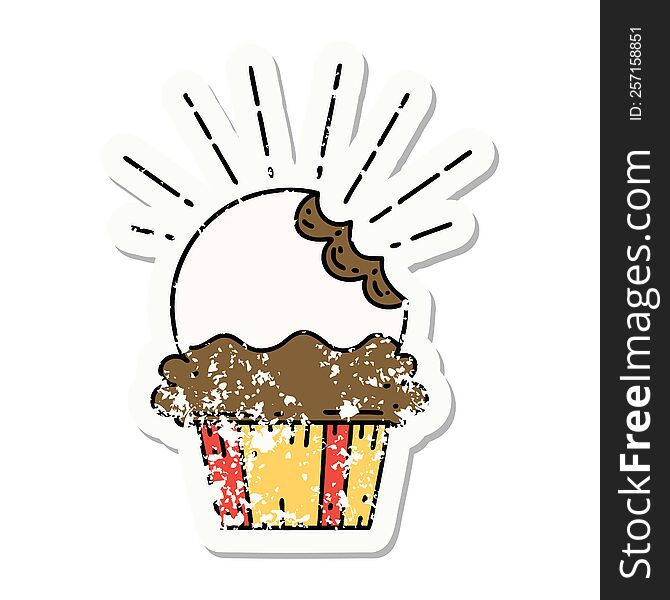 worn old sticker of a tattoo style cupcake with missing bite. worn old sticker of a tattoo style cupcake with missing bite