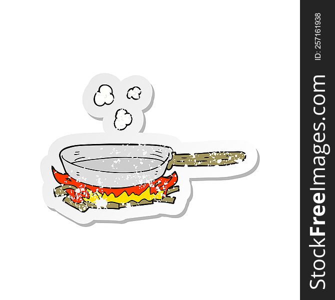 retro distressed sticker of a cartoon frying pan on fire