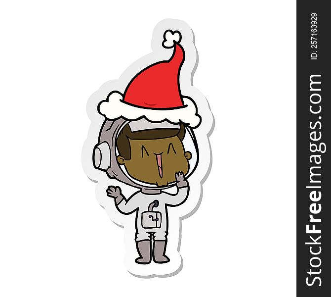 laughing sticker cartoon of a astronaut wearing santa hat