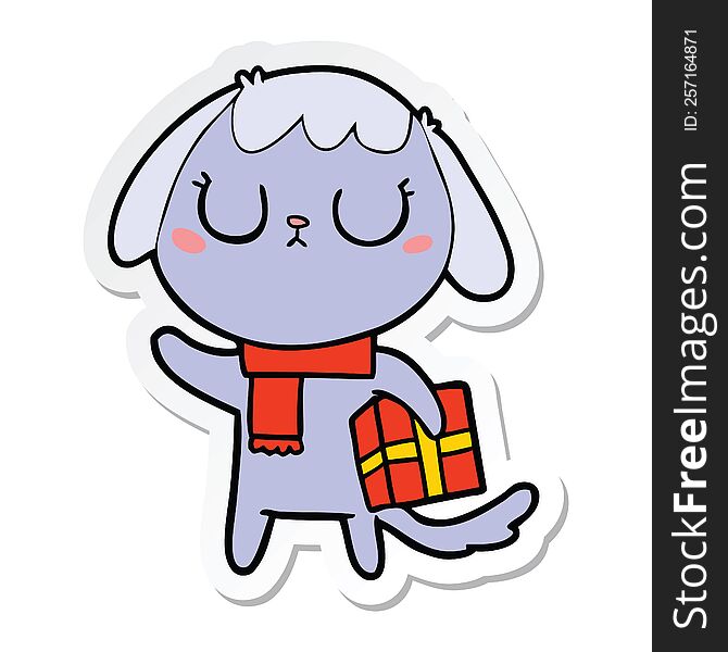 sticker of a cute cartoon dog with christmas present