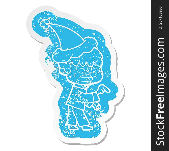 worried quirky cartoon distressed sticker of a boy wearing santa hat