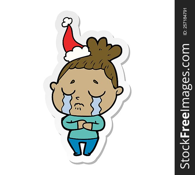 hand drawn sticker cartoon of a crying woman wearing santa hat