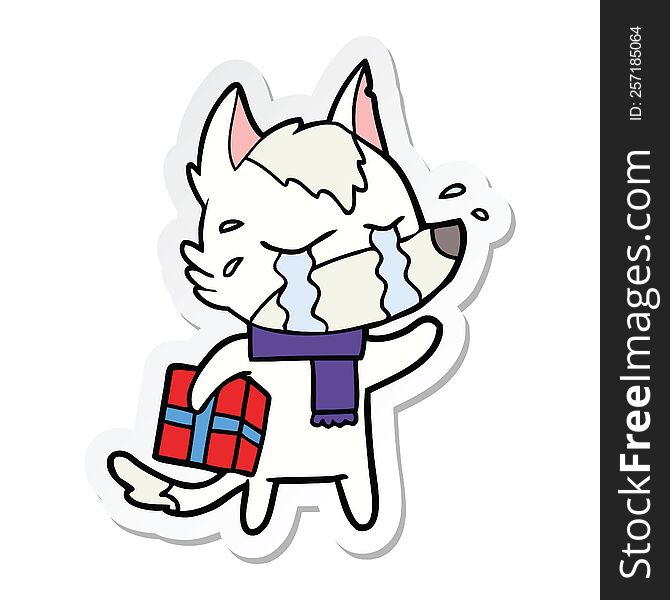 Sticker Of A Cartoon Crying Wolf With Christmas Present
