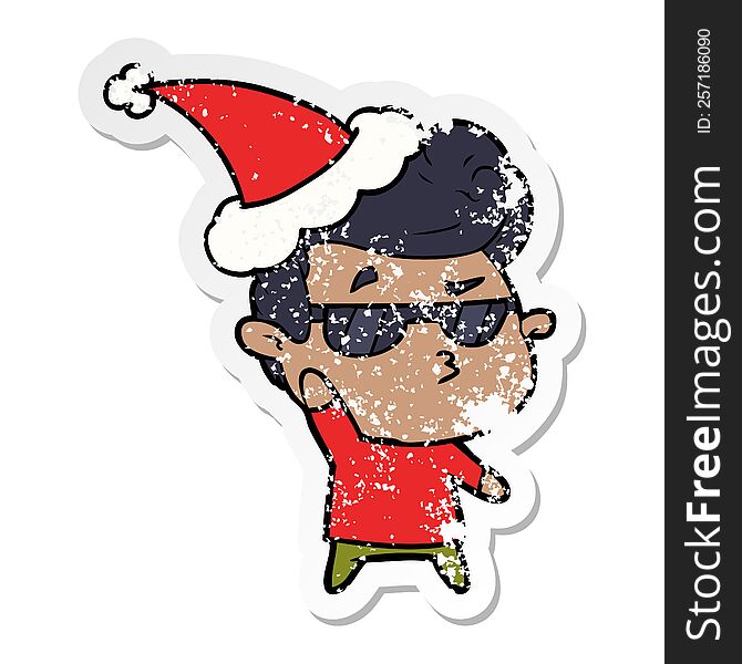 Distressed Sticker Cartoon Of A Cool Guy Wearing Santa Hat