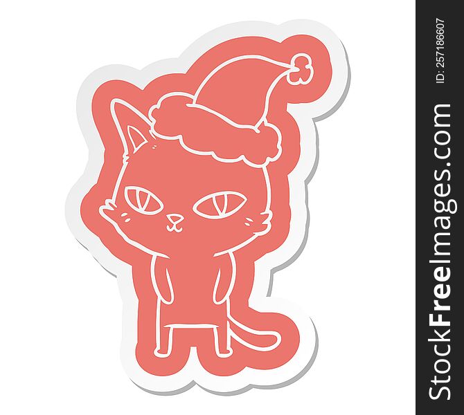 cartoon  sticker of a cat with bright eyes wearing santa hat