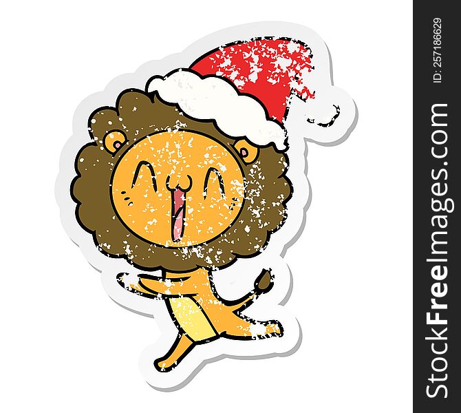 Happy Distressed Sticker Cartoon Of A Lion Wearing Santa Hat