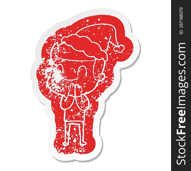 quirky cartoon distressed sticker of a friendly man wearing santa hat