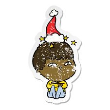 Distressed Sticker Cartoon Of A Amazed Boy Wearing Santa Hat Stock Photo