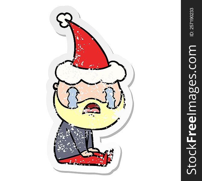 Distressed Sticker Cartoon Of A Bearded Man Crying Wearing Santa Hat