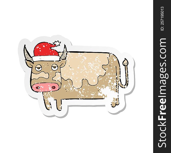 retro distressed sticker of a cartoon cow with christmas hat