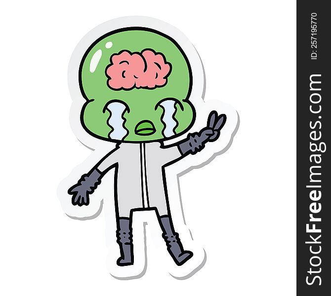 sticker of a cartoon big brain alien crying and giving peace sign