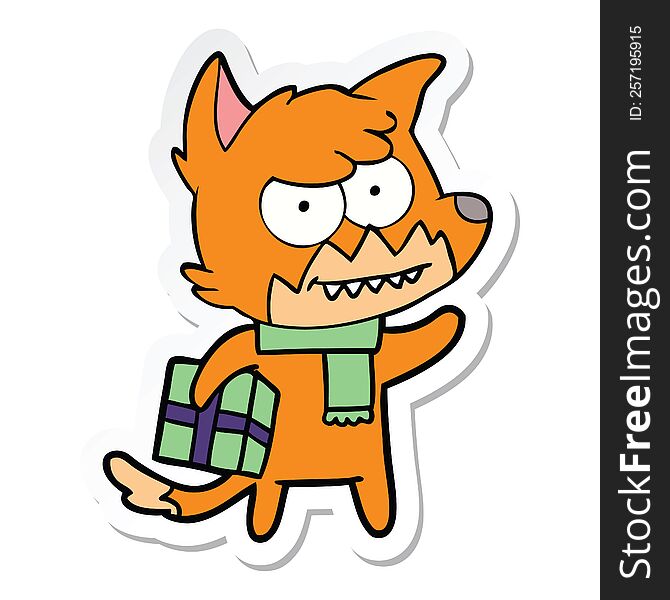 Sticker Of A Cartoon Grinning Fox With Christmas Present