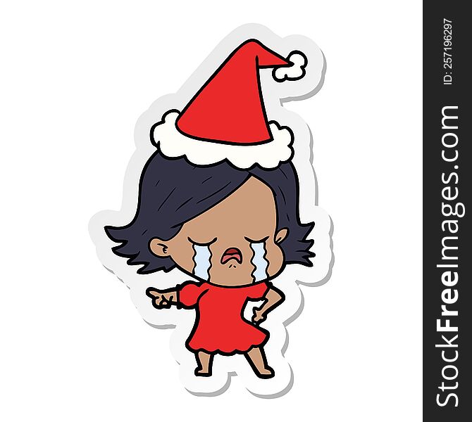 hand drawn sticker cartoon of a girl crying and pointing wearing santa hat