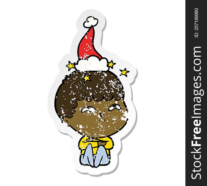 hand drawn distressed sticker cartoon of a amazed boy wearing santa hat