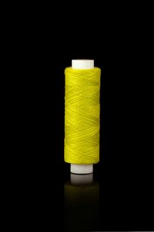 Yellow Spindle Of Yarn Royalty Free Stock Photography