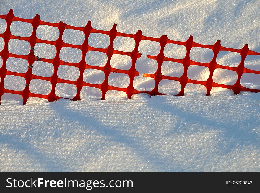 Snow fence buried in snow on Lake Monona