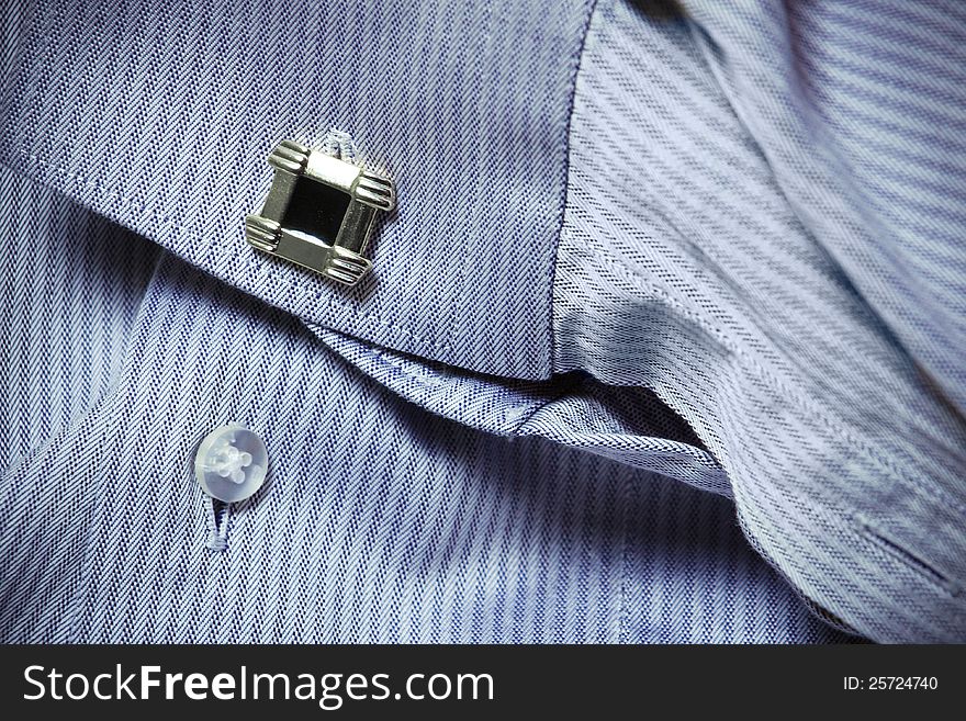 Shirt-sleeve with cuff link close-up. Shirt-sleeve with cuff link close-up