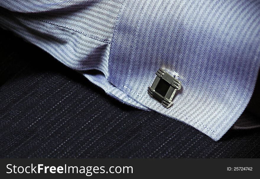 Shirt-sleeve with cuff link close-up. Shirt-sleeve with cuff link close-up