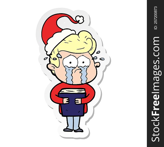 hand drawn sticker cartoon of a crying man holding book wearing santa hat