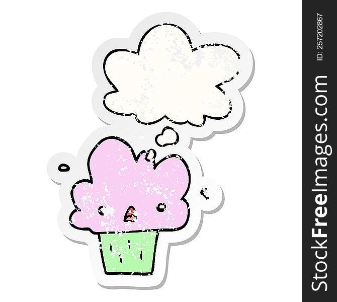 Cartoon Cupcake And Thought Bubble As A Distressed Worn Sticker
