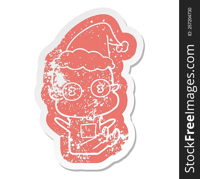 quirky cartoon distressed sticker of a weird bald spaceman wearing santa hat