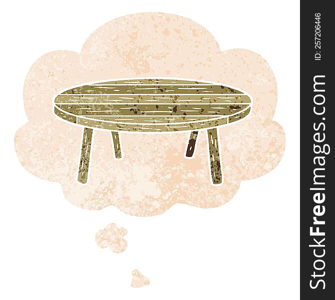 cartoon table with thought bubble in grunge distressed retro textured style. cartoon table with thought bubble in grunge distressed retro textured style