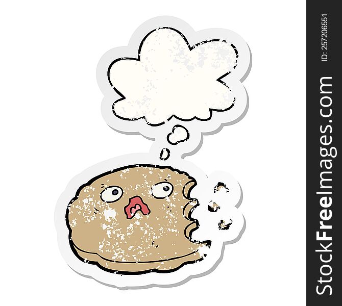cartoon bitten cookie with thought bubble as a distressed worn sticker