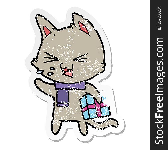Distressed Sticker Of A Cartoon Hissing Cat With Christmas Present