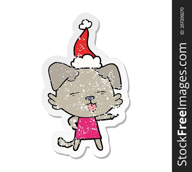 Distressed Sticker Cartoon Of A Dog Sticking Out Tongue Wearing Santa Hat