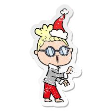 Distressed Sticker Cartoon Of A Woman Wearing Spectacles Wearing Santa Hat Stock Photo