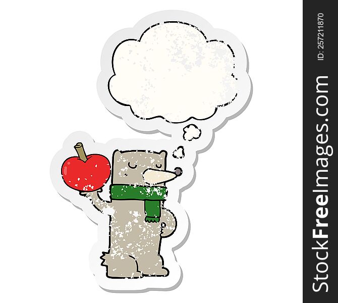 cartoon bear with apple with thought bubble as a distressed worn sticker