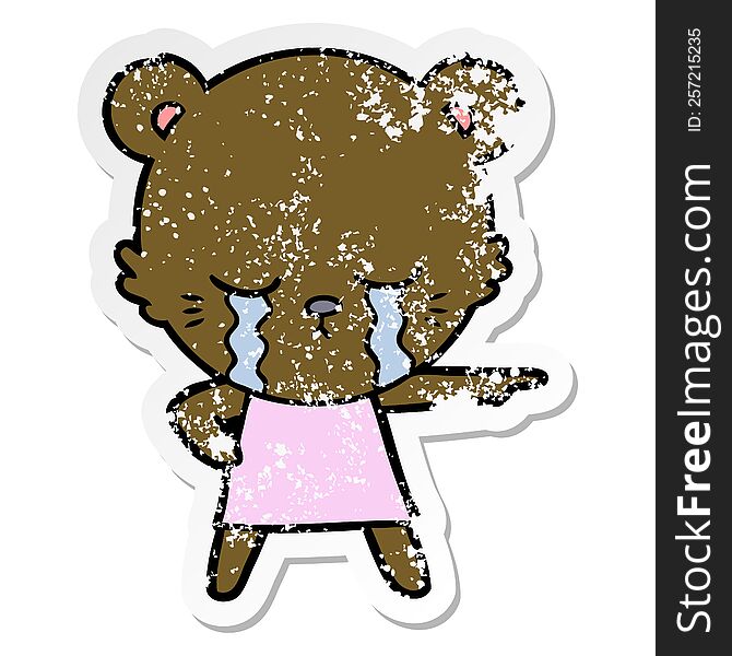 Distressed Sticker Of A Crying Cartoon Bear In Dress Pointing