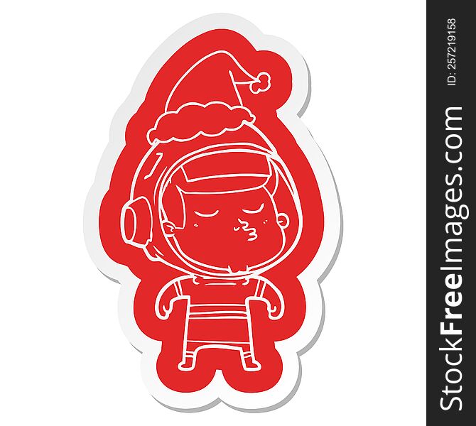 quirky cartoon  sticker of a confident astronaut wearing santa hat