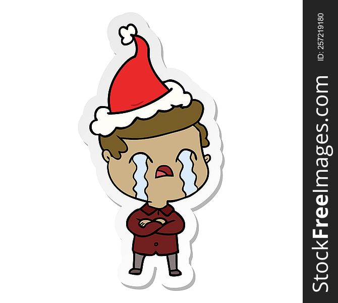 hand drawn sticker cartoon of a man crying wearing santa hat