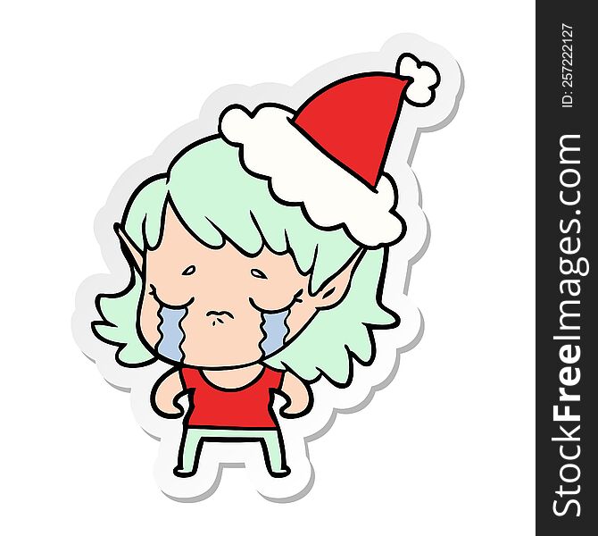 Sticker Cartoon Of A Crying Elf Girl Wearing Santa Hat