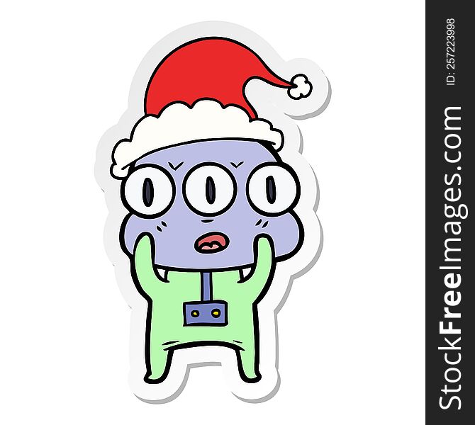 sticker cartoon of a three eyed alien wearing santa hat